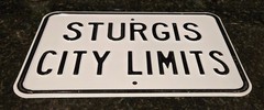Sturgis city limits embossed motorcycle biker road sign 18×12