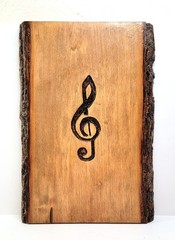 Handmade Wood slice wall art with engraved Treble or G Clef music note.