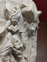bas-relief sculpture of a fairy and flowers Irises Iridaceae Hand Crafted Stone