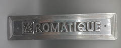 Vintage Aluminum AROMATIQUE Sign 3.25″ x 13.75″