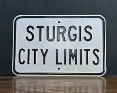Sturgis city limits embossed motorcycle biker road sign 18×12