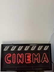 Light Up Cinema Sign . Black With Red And White Lights.