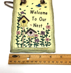 Ceramic wall hanging saying “Welcome to Our Nest” bird birdhouse flowers
