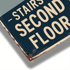 Distressed metal sign featuring stairway graphic for indoor directional use