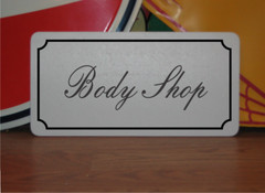 Body Shop Metal Sign in Fancy Script and Black Border