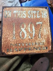 On This Site In 1897 Nothing Happened” novelty sign