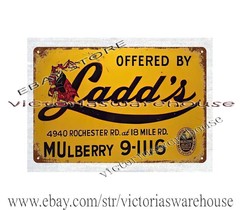 collectible home furnishings LADD’S REAL ESTATE metal tin sign