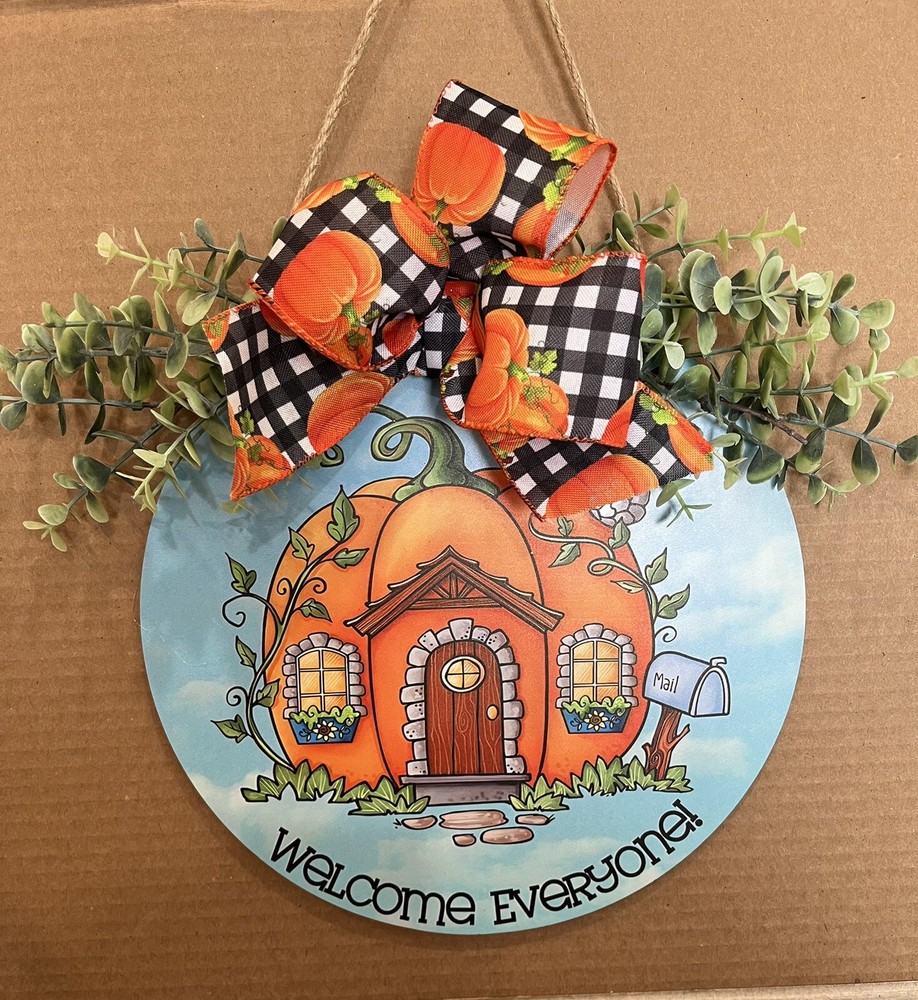 Wood hanging sign WELCOME Blue and Orange in color.