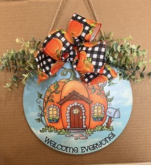 Wood hanging sign WELCOME Blue and Orange in color.